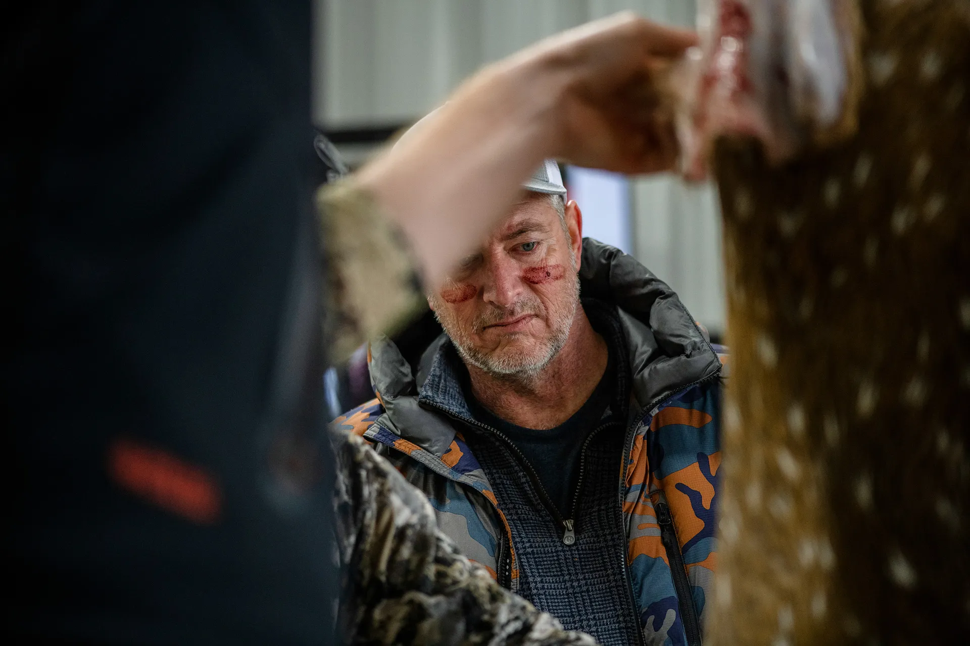 Hunter inspecting a trophy